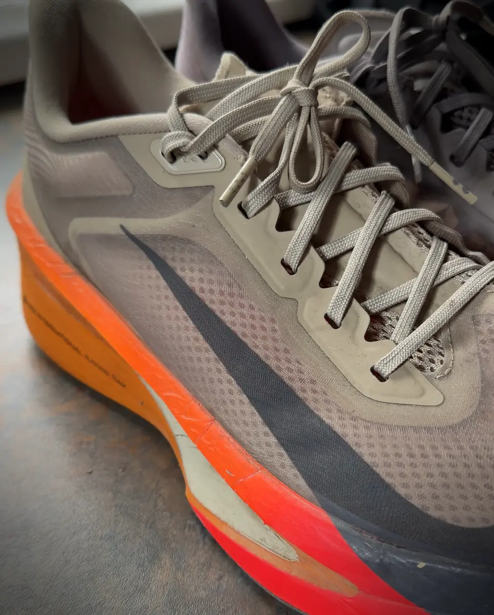Close-up of the worn Nike Zoom Fly 6 upper, showing the mesh, laces and orange midsole